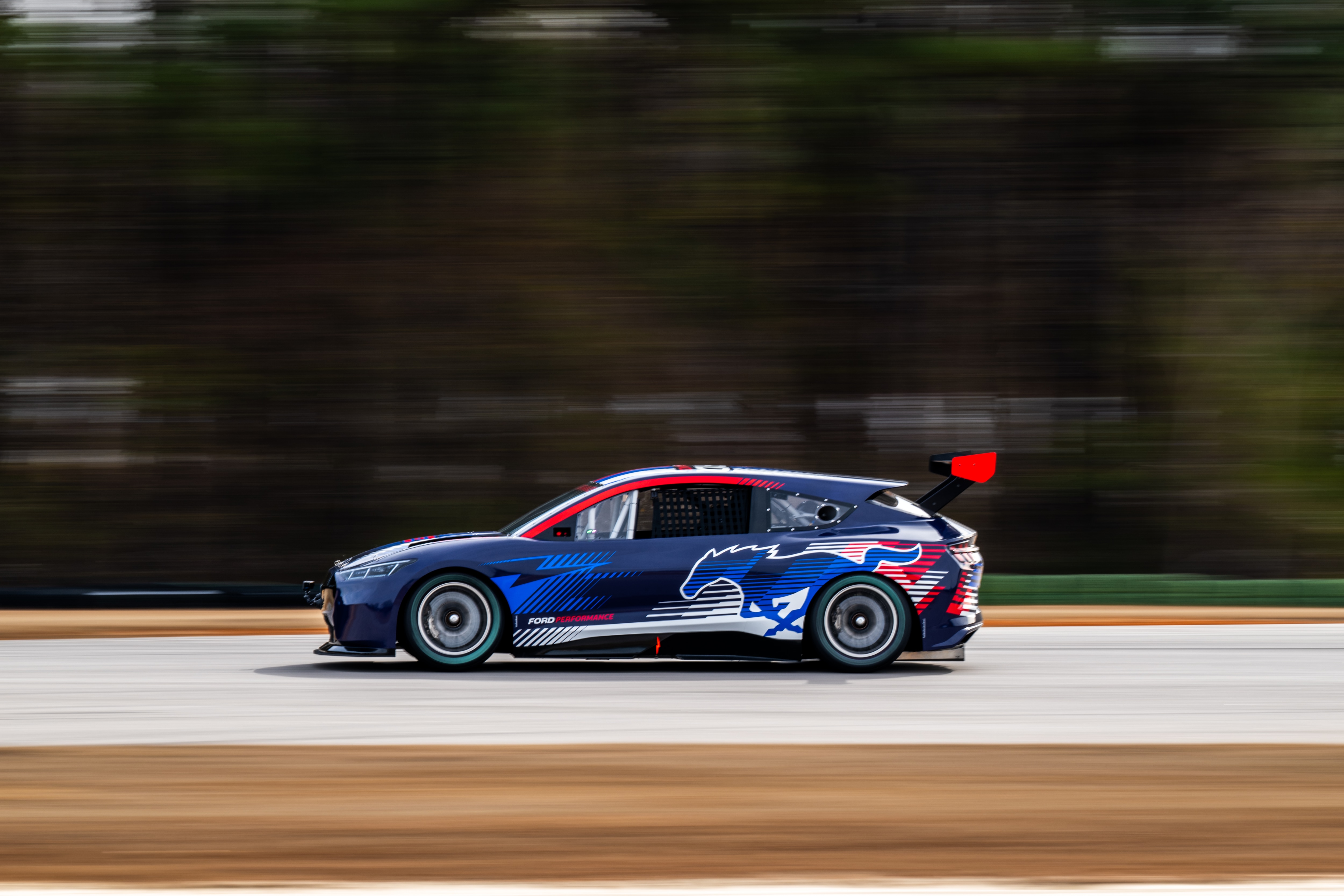This 100% electric racer is the latest demonstrator to join the Ford Performance family following SuperTruck, SuperVan 4.2, Super Cobra Jet 1800 and others. The new Mach-E demonstrator features components from the current Cup Series car including suspension, brakes, steering and wheels. It also features three motors, a full carbon fiber tub, and a 78 kWh battery. 